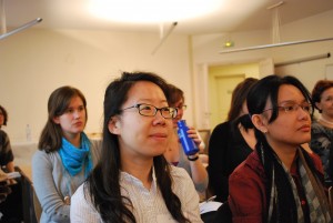 The audience looks on